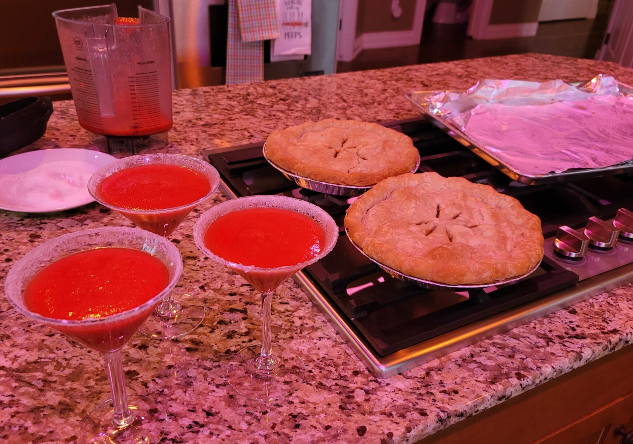 Golden-brown tourtière pies with crimped pastry edges, showing savory meat and potato filling inside